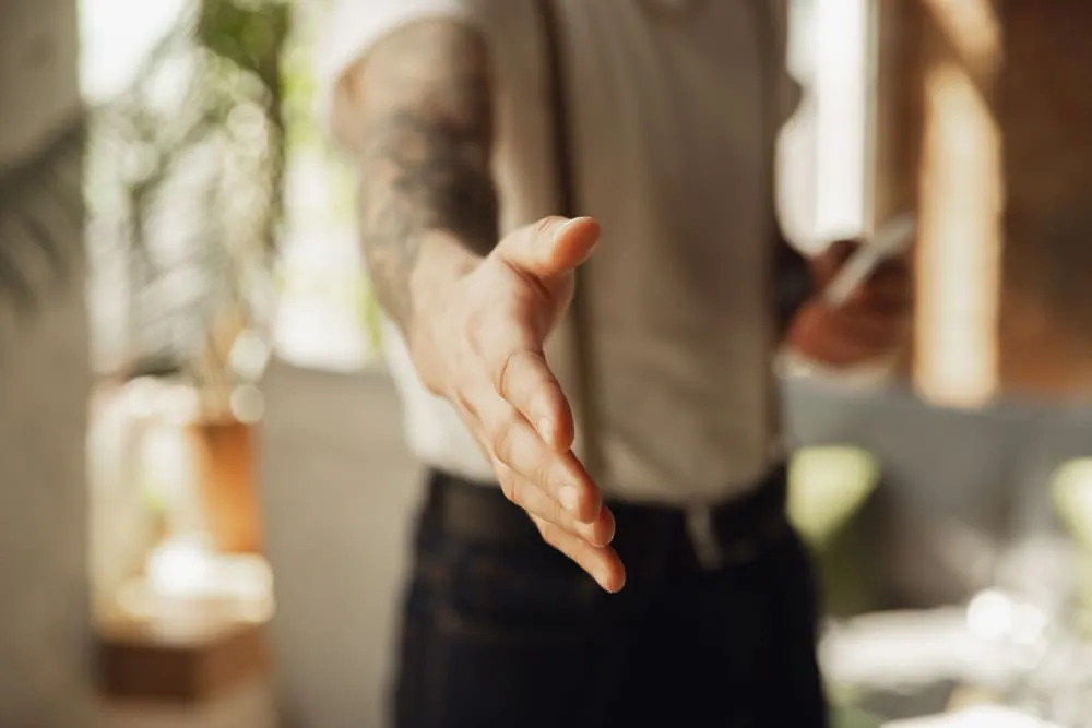 close-up-of-male-hand-greeting-welcoming-somebody (1)
