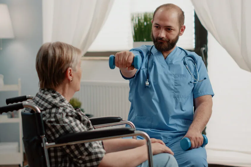 medical-assistant-giving-assistance-to-disabled-old-woman