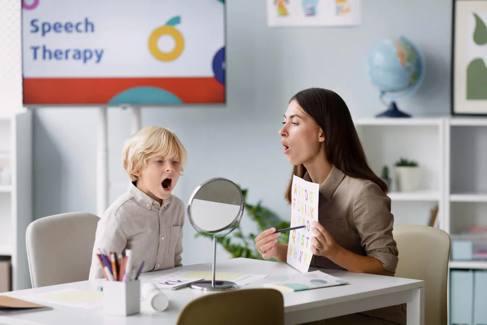 woman-doing-speech-therapy-with-little-boy-at-her-clinic (1)
