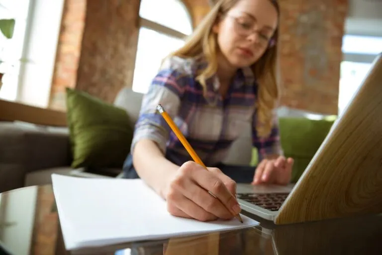 young-woman-studying-at-home-during-online-courses-or-free-information-by-herself-making-notes (1)